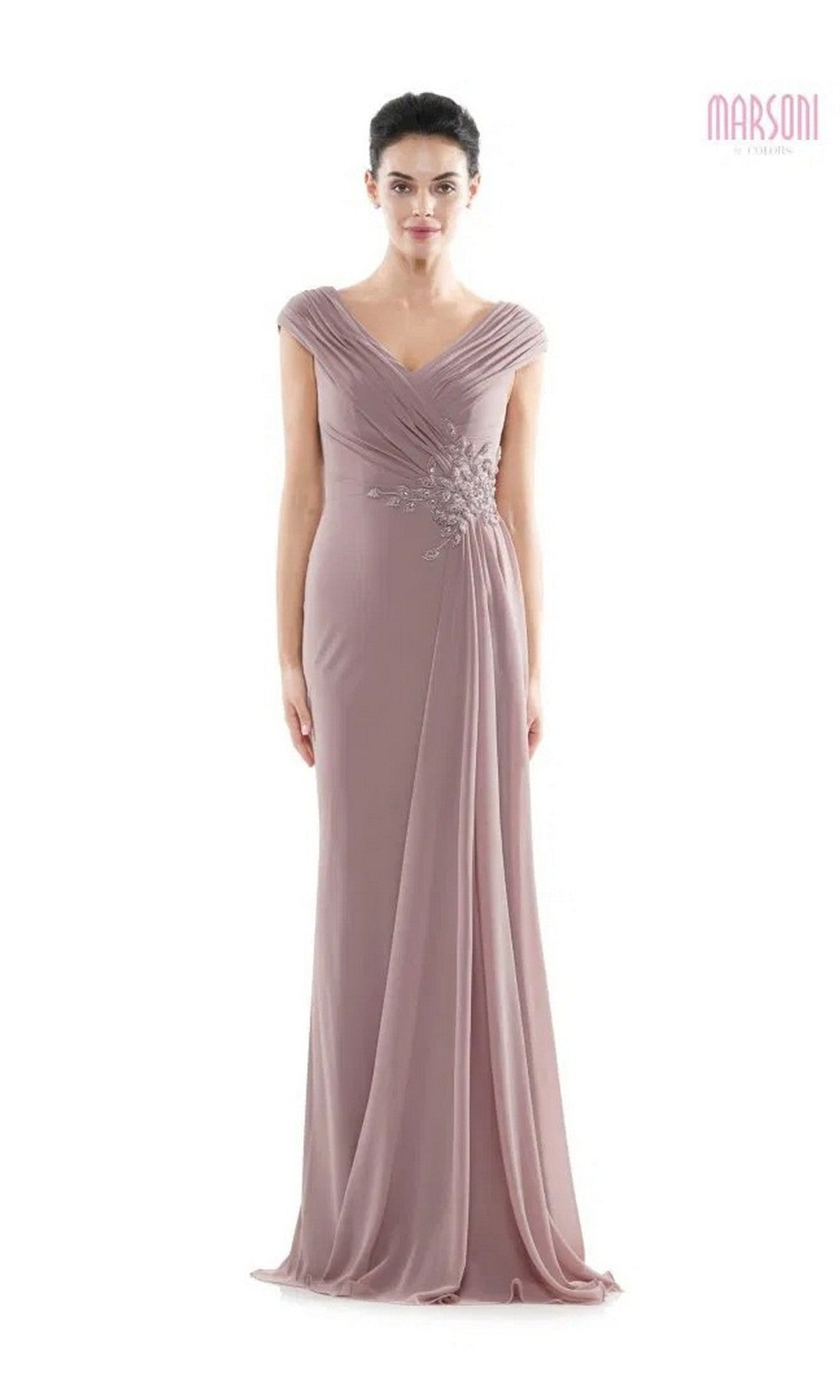 A woman models the Marsoni MV1080 long formal dress in mauve, featuring chiffon fabric, cap sleeves, pleated shoulders, and a beaded waist applique, standing against a plain white background.
